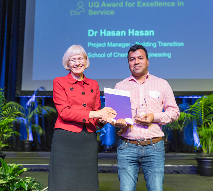 ​​Dr Hasan Hasan, Project Manager, Building Transition, School of Chemical Engineering, Service Winner, 2022 UQ Awards for Excellence with Professor Deborah Terry AO, Vice-Chancellor and President.